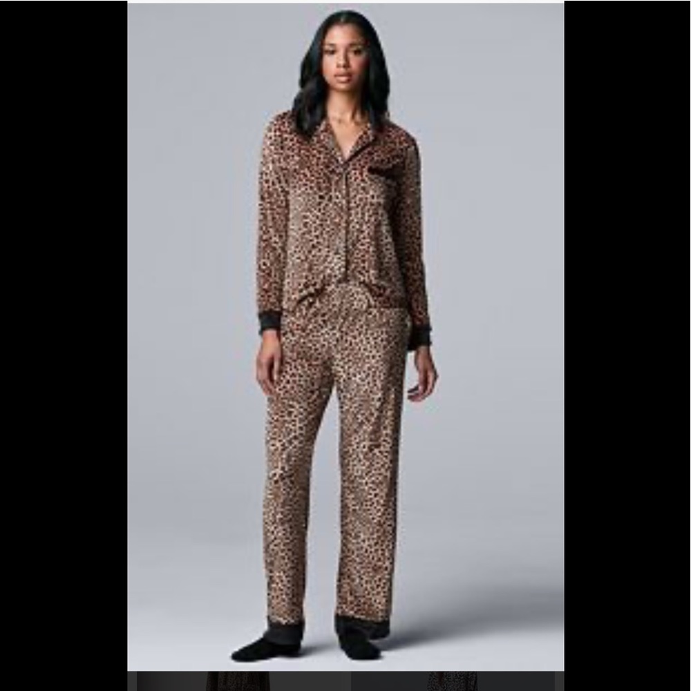 Two Piece Pajama Set.  Long bottoms and button up top.  NWT. Very soft.